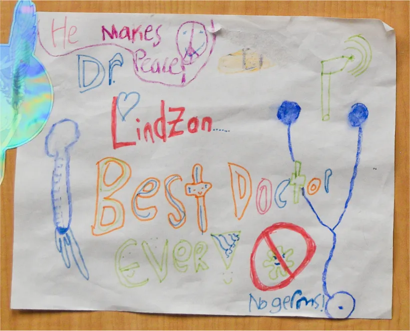 A child’s drawing that reads “Dr. Lindzon, Best Doctor Ever” with a thermometer, a stethoscope and “No germs!”