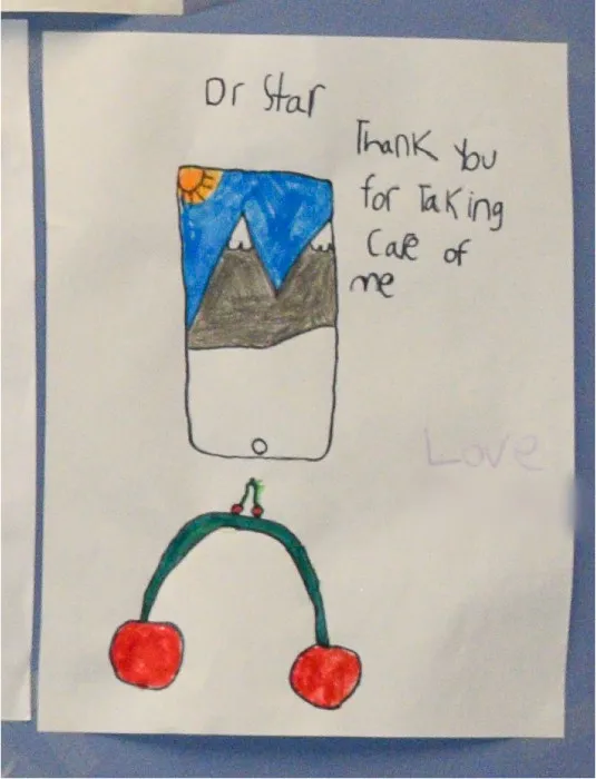 A child’s drawing for Dr. Star that reads “Thank you for taking care of me” with a picture of mountains and a pair of cherries